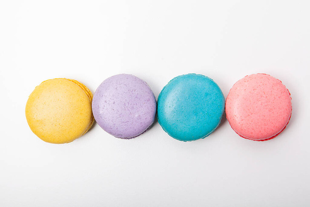 Sweet and colorful macaron on white background. Sweet snacks. - Photo, Image