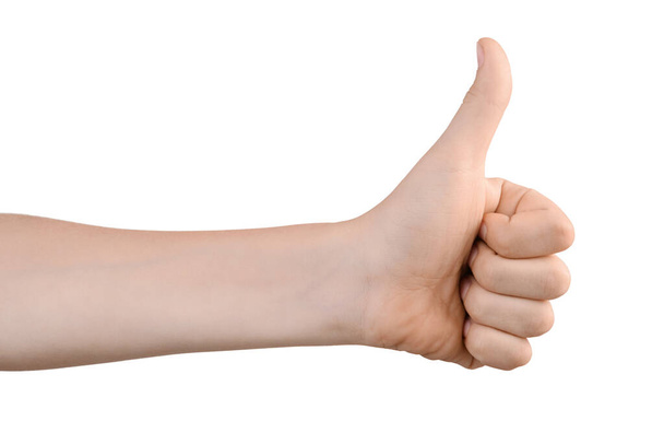 The boy's left hand shows thumb up for OK sign. Hand shows a gesture of approval. Everything is cool, everything is OK. Isolated on white. Success concept. - Foto, Imagen