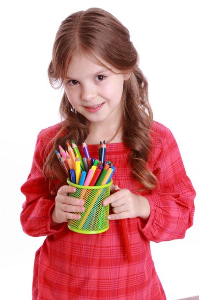 Little girl with colored pencils - Fotó, kép