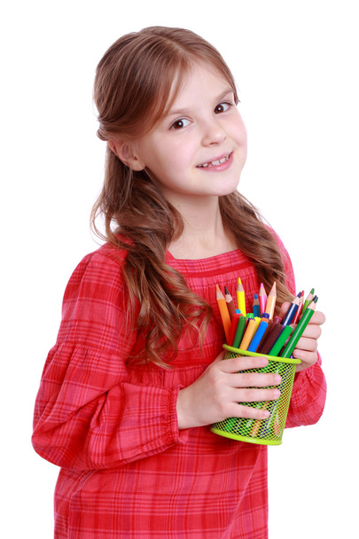 Little girl with colored pencils - Foto, afbeelding