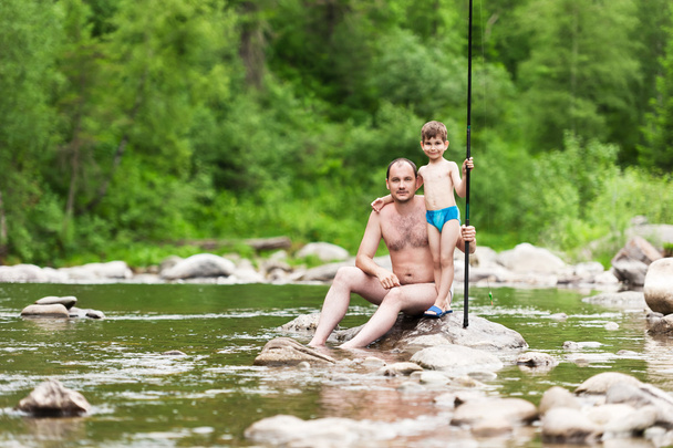 Father and son fishing - Foto, afbeelding
