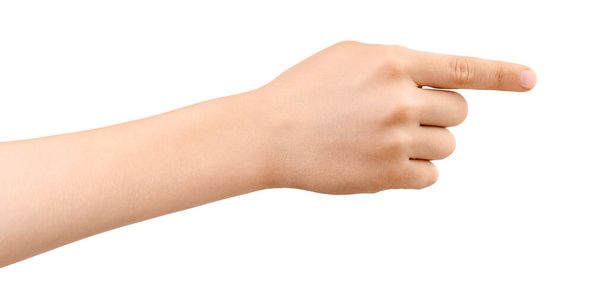 Ręka dziecka wskazująca na coś palcem wskazującym lub dotykającym, odizolowana na białym tle. Gesta wyboru. Widok boczny. - Zdjęcie, obraz