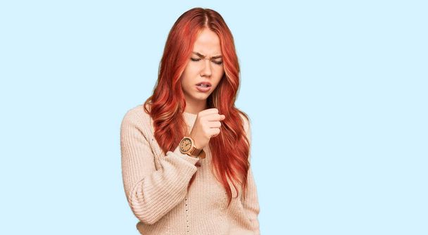 Young redhead woman wearing casual winter sweater feeling unwell and coughing as symptom for cold or bronchitis. health care concept.  - Photo, Image
