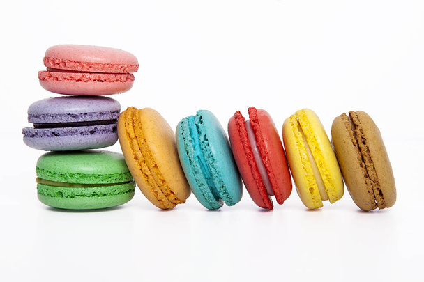 Sweet and colorful macaron on white background. Sweet snacks. - 写真・画像