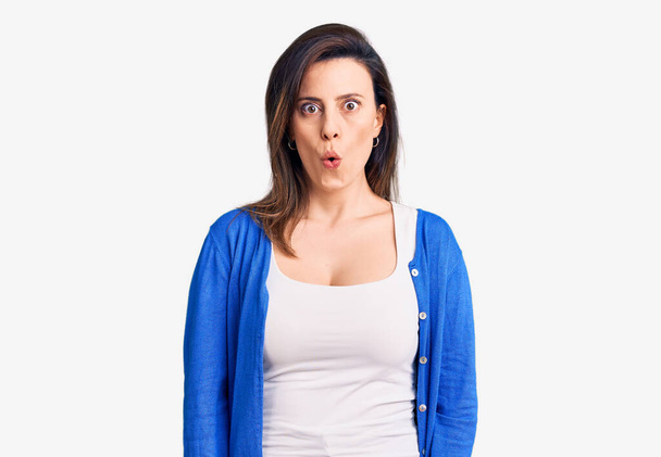 Young beautiful woman wearing casual clothes scared and amazed with open mouth for surprise, disbelief face  - Photo, Image