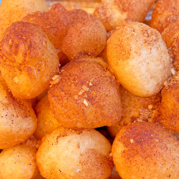 "Lukuma" fried sweet pankake balls with honey syrup, nuts and cinammon - Photo, Image