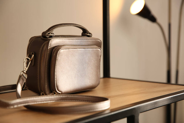 Elegant grey bag on shelf in luxury boutique - Valokuva, kuva