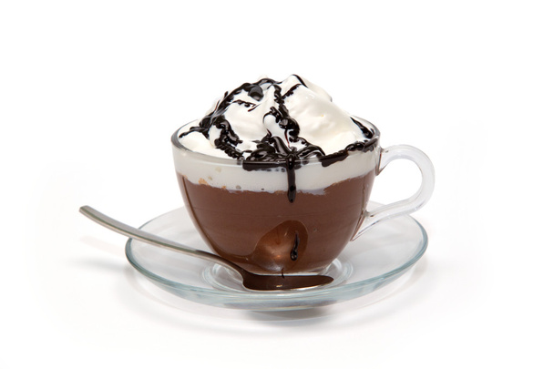 Hot chocolate with cream and syrup in glass cup - Photo, Image