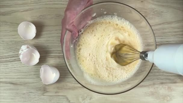 Woman mixed eggs by electric mixer - Footage, Video