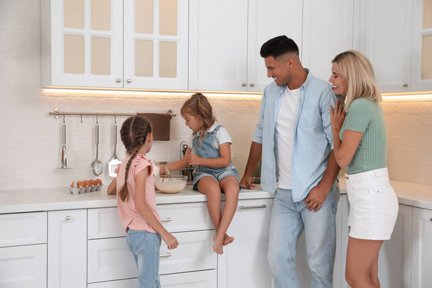 Happy family cooking together in modern kitchen - Foto, immagini