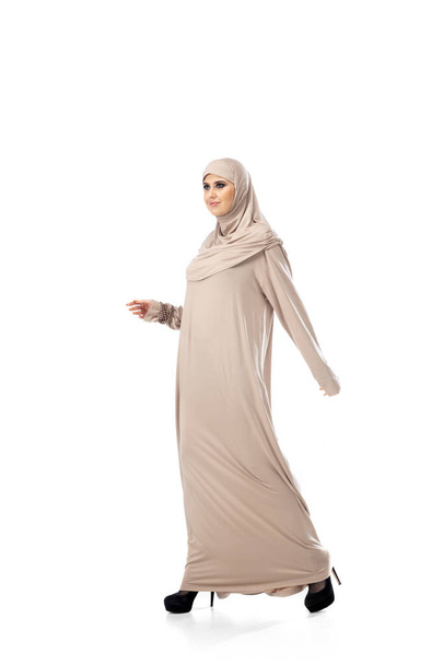 Beautiful arab woman posing in stylish hijab isolated on studio background. Fashion concept - Φωτογραφία, εικόνα