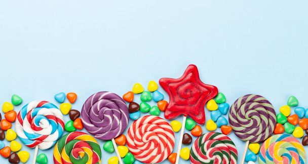 Various candy sweets and lollipop. Top view flat lay with copy space - Photo, Image