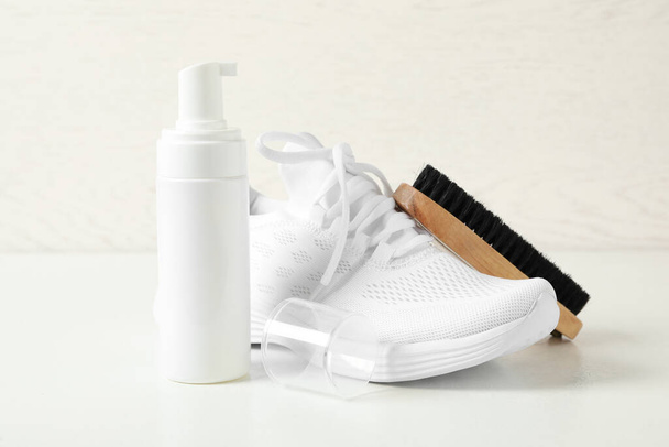 Stylish footwear and shoe care accessories on white background - Photo, image