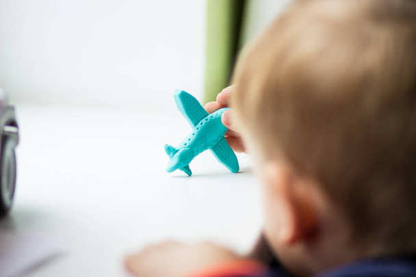 Baby plays plane made of clay - Photo, image