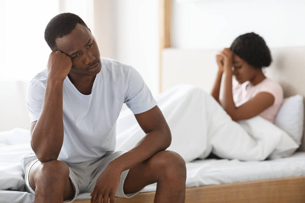Upset young african american couple after fight, bedroom interior - Fotoğraf, Görsel