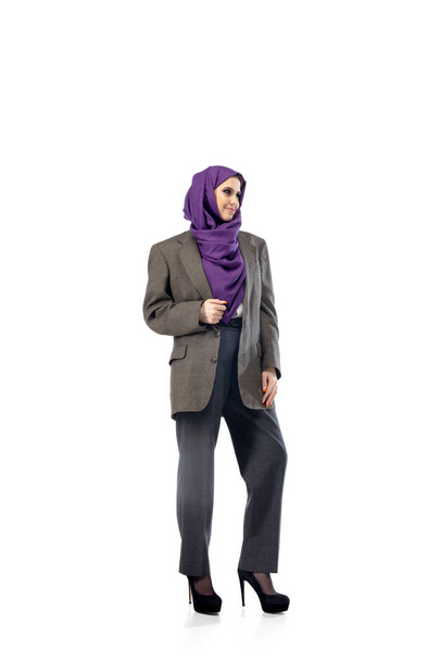 Beautiful arab woman posing in stylish office attire isolated on studio background. Fashion concept - Фото, изображение