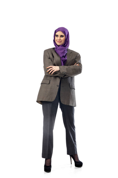 Beautiful arab woman posing in stylish office attire isolated on studio background. Fashion concept - Fotó, kép