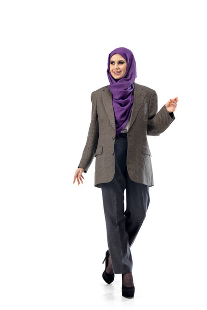 Beautiful arab woman posing in stylish office attire isolated on studio background. Fashion concept - Foto, imagen
