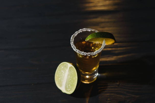 Tequila shot with lime . Selective focus - Foto, imagen