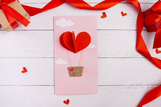 Valentines diy. Step by step instruction for handmade valentine greeting card with parachute from hearts. Craft gift, flat lay. step 3 - Fotó, kép