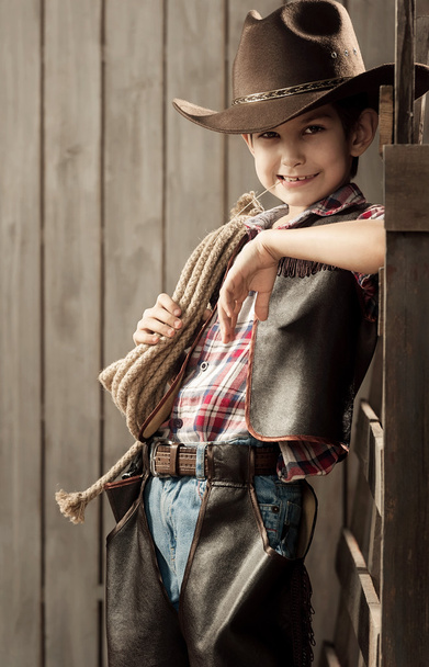 Boy dressed as a cowboy - Фото, изображение