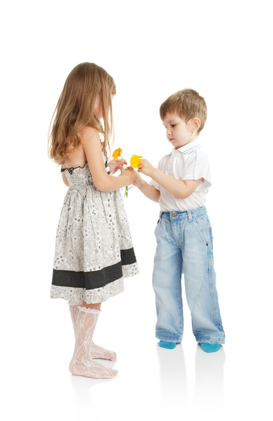 Boy and girl with flowers - Фото, зображення