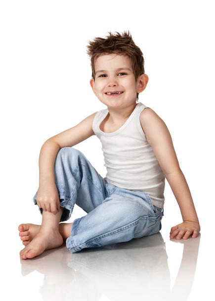 Sitting boy in jeans - Φωτογραφία, εικόνα