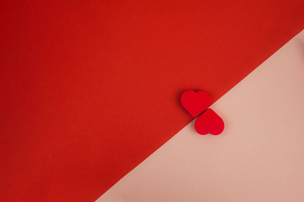two red hearts on a red-pink background. High quality photo - Foto, Imagem