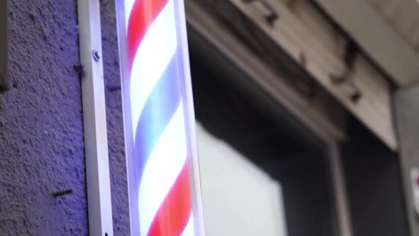 A barbers pole, unusual symbol of barbershops - Footage, Video