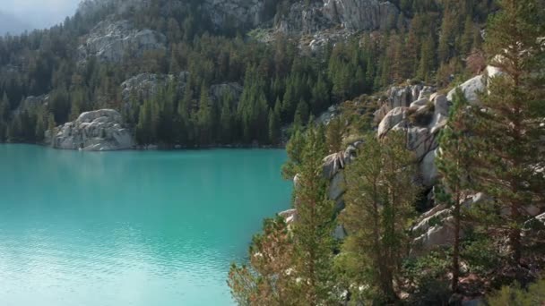 Cinematic blue lake aerial view. Fresh glacier water. Blue water in forest lake - Footage, Video