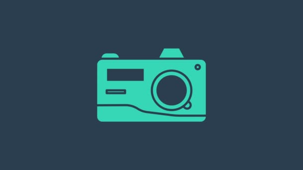 Tyrkysová ikona fotoaparátu izolované na modrém pozadí. Ikona fotoaparátu. Grafická animace pohybu videa 4K - Záběry, video