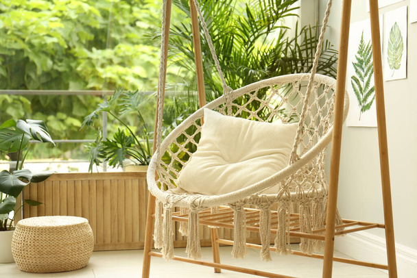 Comfortable hammock chair in stylish room. Home interior - Photo, image