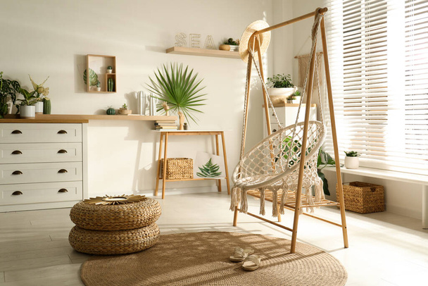 Comfortable hammock chair in stylish room. Interior design - Zdjęcie, obraz