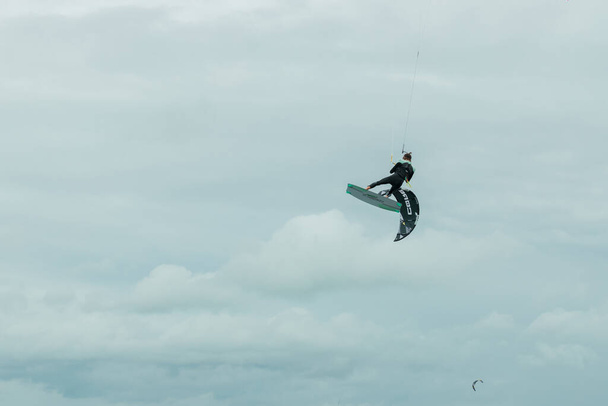 kitesurfer flies across the sky of the North Sea in Germany - Photo, Image