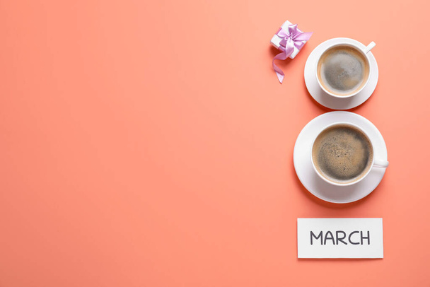 8 March greeting card design with cups of coffee, gift box and space for text on coral background, flat lay. International Women's day - Φωτογραφία, εικόνα