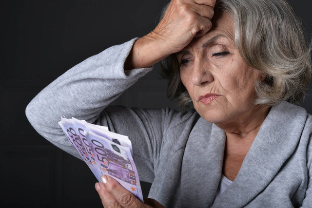 unhappy  elderly woman with euros - Fotoğraf, Görsel