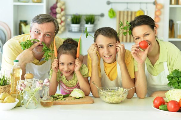Cute family cooking together in kitchen having fun  - Photo, image