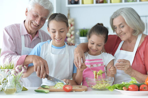 family cooking together in kitchen - Photo, image