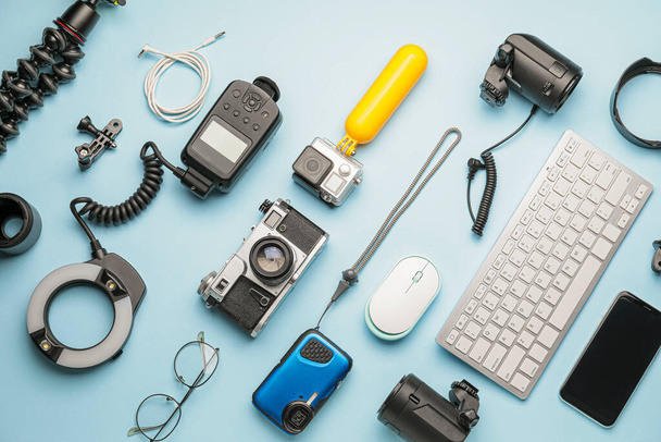 Composition of modern photographer's equipment and computer keyboard on color background - Photo, Image
