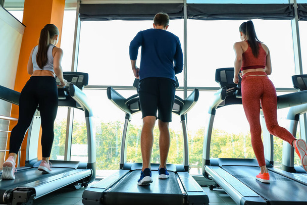 People training on treadmills in gym - Photo, Image