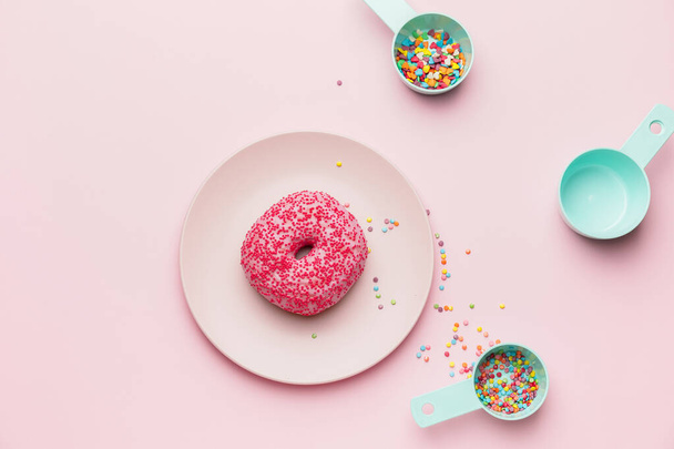 Composition with sweet donut on color background - Valokuva, kuva