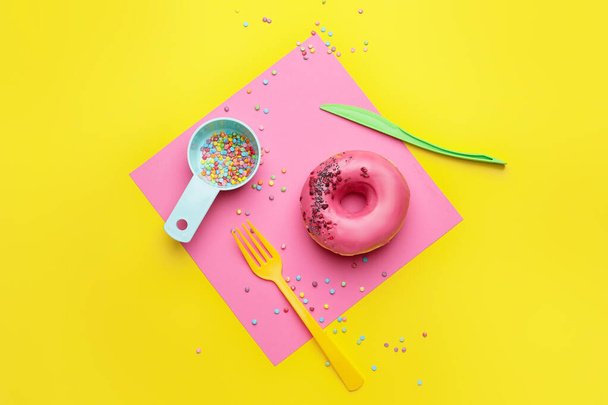 Composition with sweet donut on color background - Photo, image