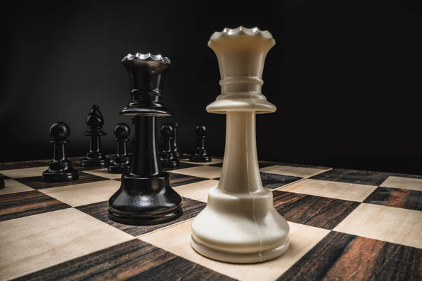 Chess board with figures on dark background - Zdjęcie, obraz
