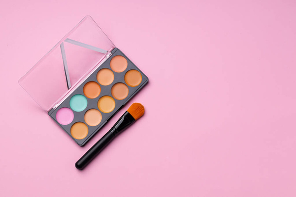 Make up palette with brush on pink background - Photo, Image