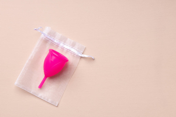 One menstrual cup on beige background top view - Foto, Imagem