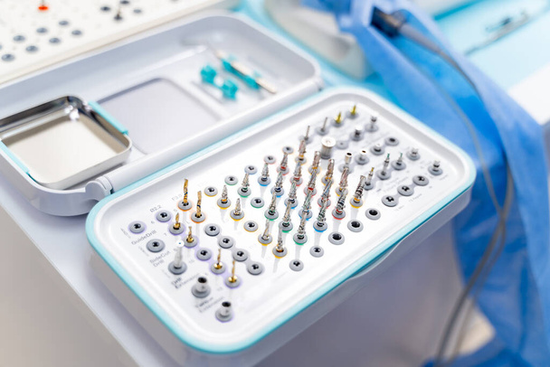 Set of professional instruments in dentist's office. Complete modern set of dentist`s drills. - 写真・画像