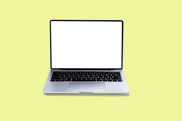 Laptop and white screen on yellow background - Photo, Image
