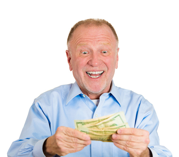 ώριμος άνδρας διακράτηση χρήματος λογαριασμούς δολαρίων στο χέρι - Φωτογραφία, εικόνα