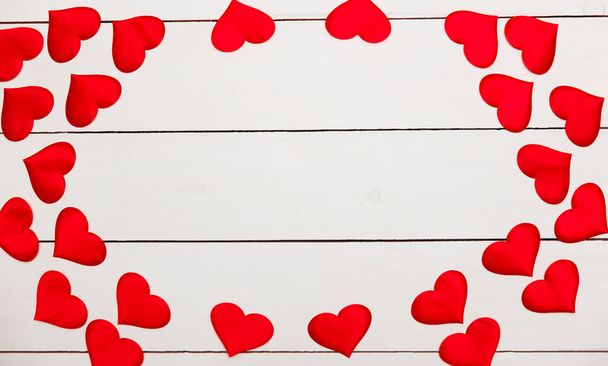 Flatlay composition with hearts on a wooden background - Foto, Bild