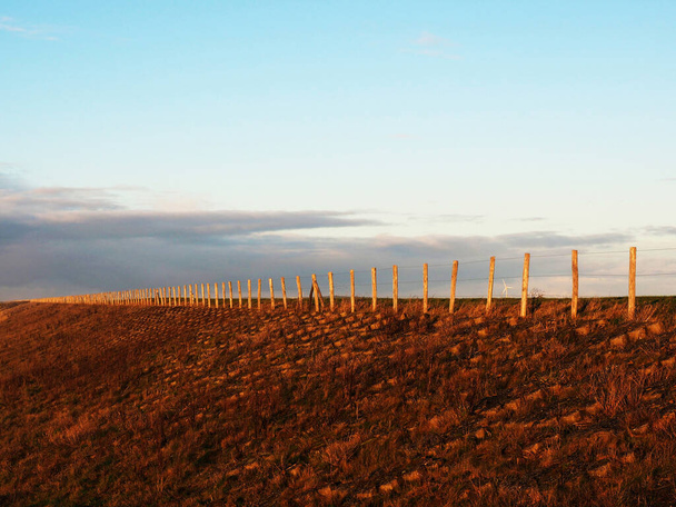 Dike and sky, fence and clouds background - Photo, Image